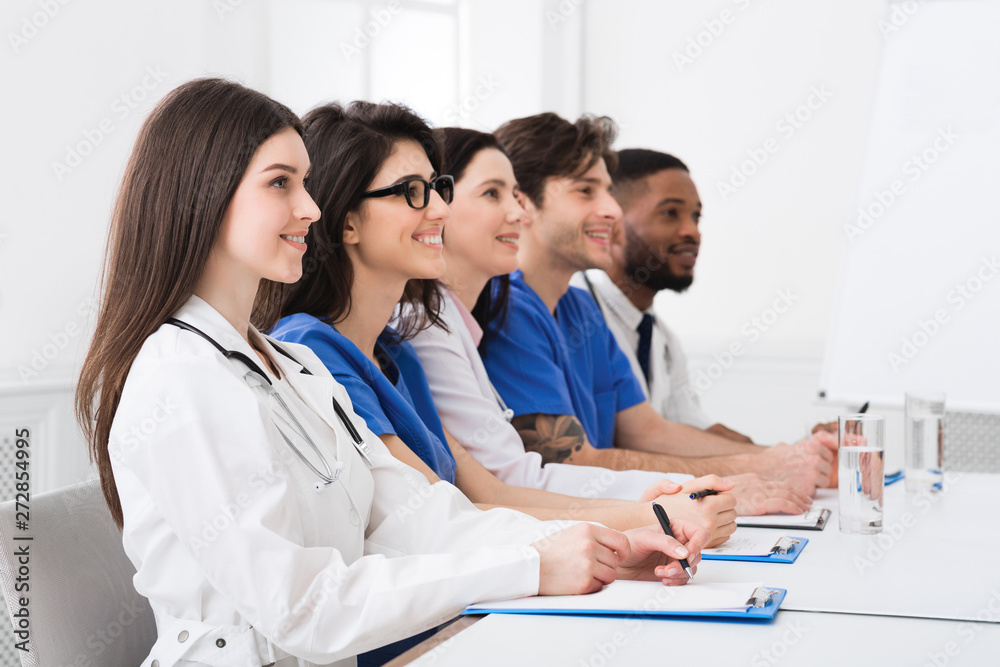 Medical Seminar. Doctors And Interns Listening To Professor