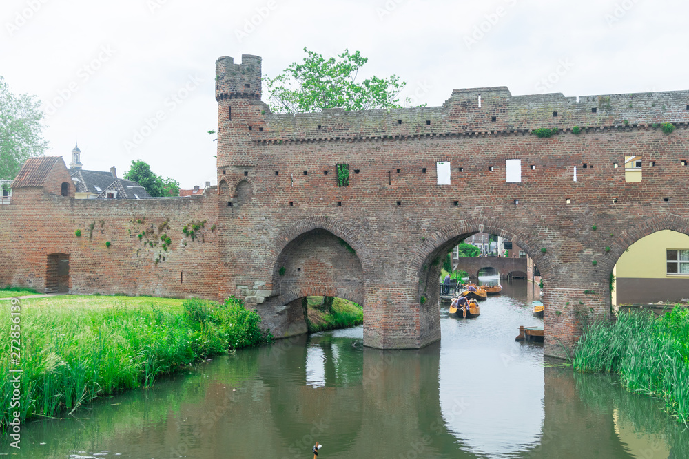 water gate with tower and city wall, called Berkelpoort in Zutphen, The Netherlands