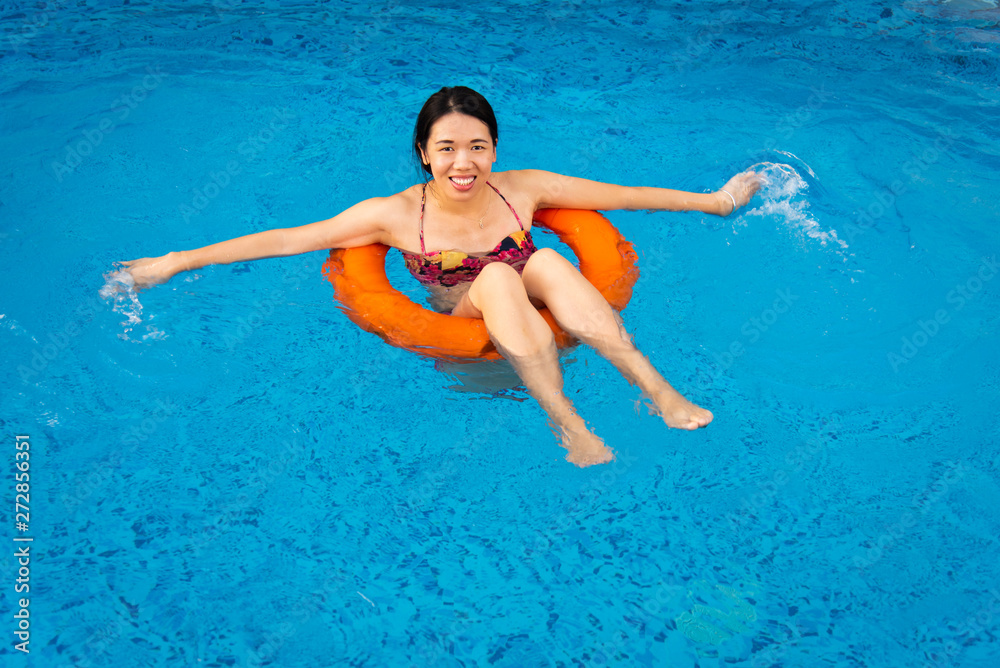 Girl enjoying at the swimming pool