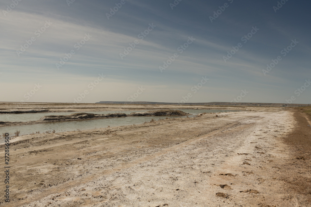 The dried-up Aral sea in summer, the water crisis on the planet and the concept of climate change