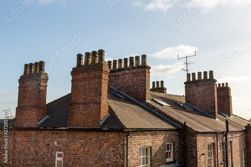 Fotografie Old roofs and typical chimneys pots in York, Yorkshire, England, UK