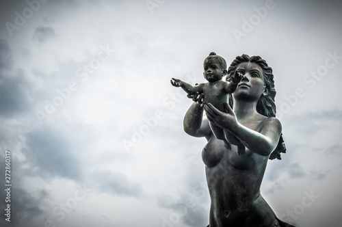Mermaid statues and child on Koh Samet