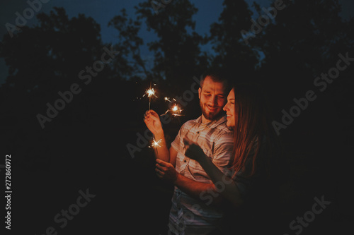 Loving Couple doing Sparkler Fireworks Together