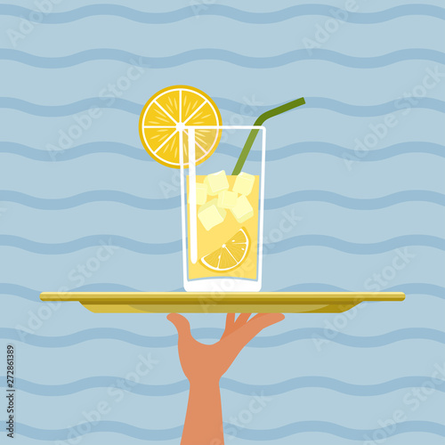 Cocktail with lemon on tray on sea background