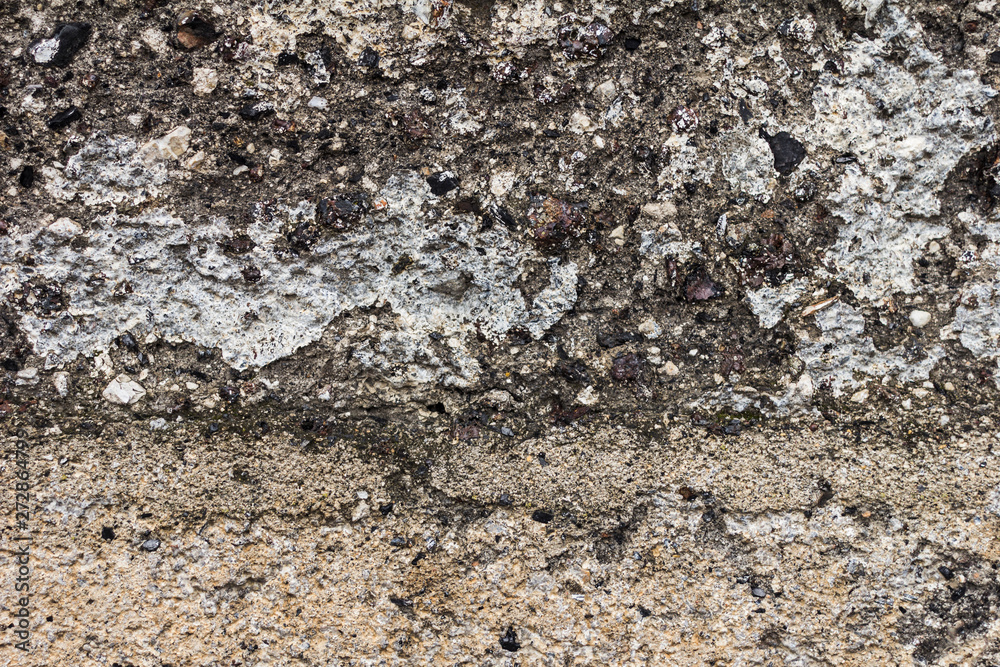The concrete texture, wall, with cracks and scratches can be used as a background, web banner with space for text The concrete texture, wall, with cracks and scratches can be used as a background, web banner with space for text