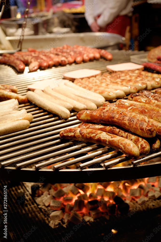 Large round barbecue of sausages and grilled meat Large round barbecue of sausages and grilled meat