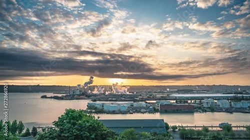 Sunrise Timelapse Over the City with Smoke Stacks