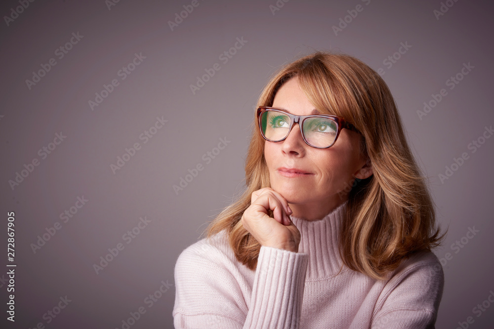 Close-up studio portrait of attractive middle aged woman Close-up studio portrait of attractive middle aged woman