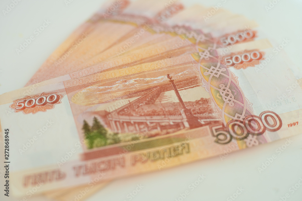 Obraz premium 5000 rubles lie on a white table close up.