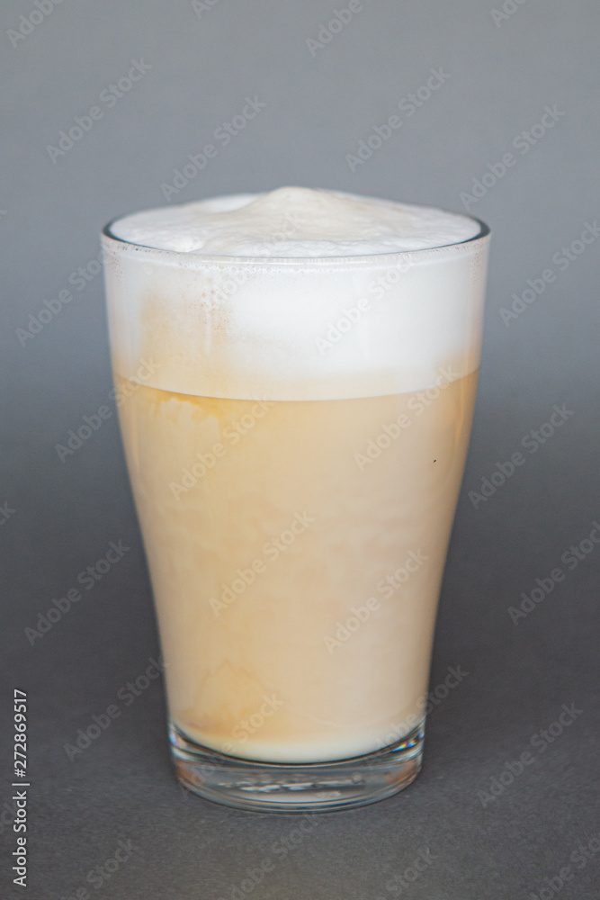large transparent glass filled with cold summer drink coffee with milk photographed on the isolated gray background picture for the menu large transparent glass filled with cold summer drink coffee with milk photographed on the isolated gray background picture for the menu