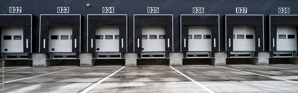 Big distribution warehouse with industrial doors for loading dock trucks