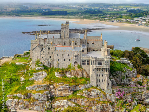 Fototapeta Naklejka Na Ścianę i Meble -  Aerial view St Michael's Mount is a small tidal island in Mount's Bay, Cornwall, England, United Kingdom. Castle and chapel on the top of the mount. 