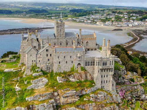 Aerial view St Michael's Mount is a small tidal island in Mount's Bay, Cornwall, England, United Kingdom. Castle and chapel on the top of the mount. 