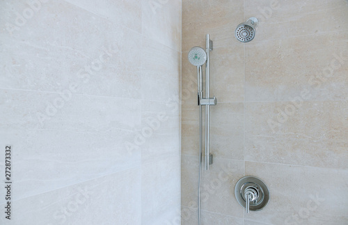 Modern shower head in bathroom with new home construction photo