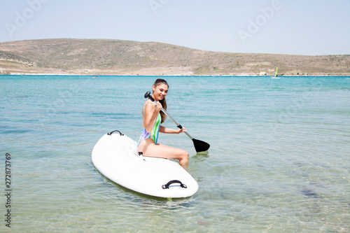 Surfer woman surfing in the ocean