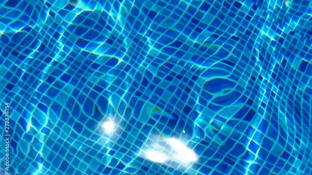 Water texture. The reflection of the rays of the sun in the clear water of the blue pool. Water texture. The reflection of the rays of the sun in the clear water of the blue pool.