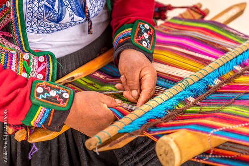 Peruvian woman working on traditional handmade wool production