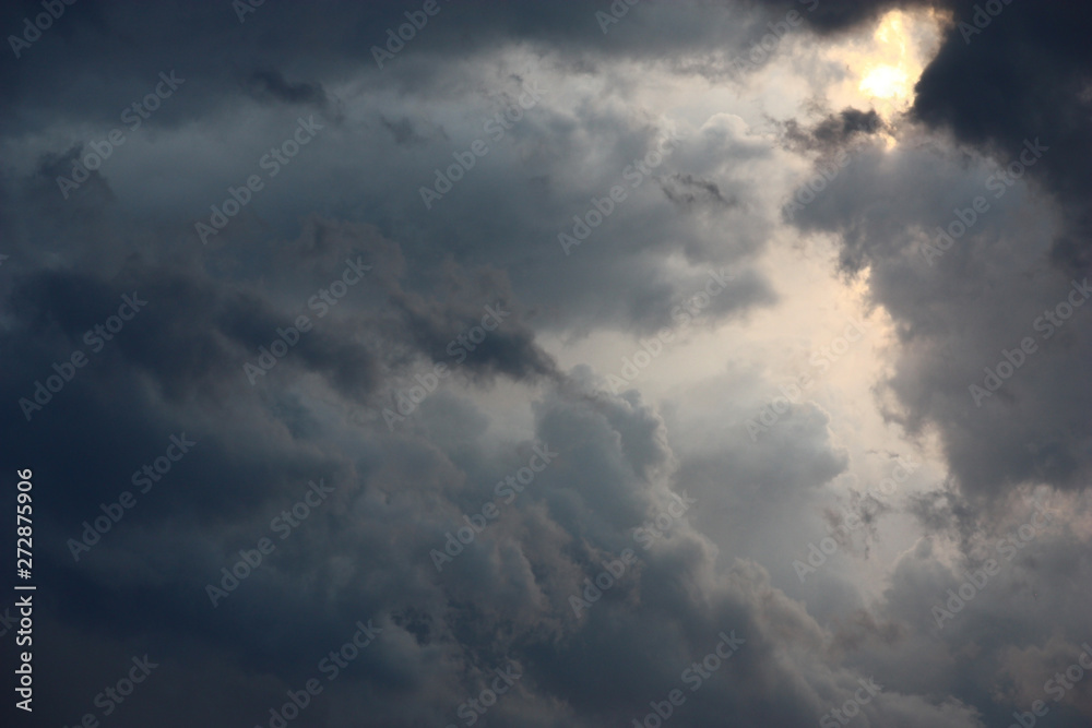 Many shades of gray color can be seen in the thundercloud which is broken off by wind.