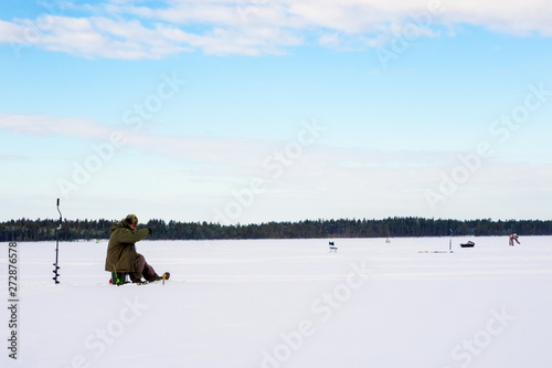 fishermen in the winter for ice fishing
