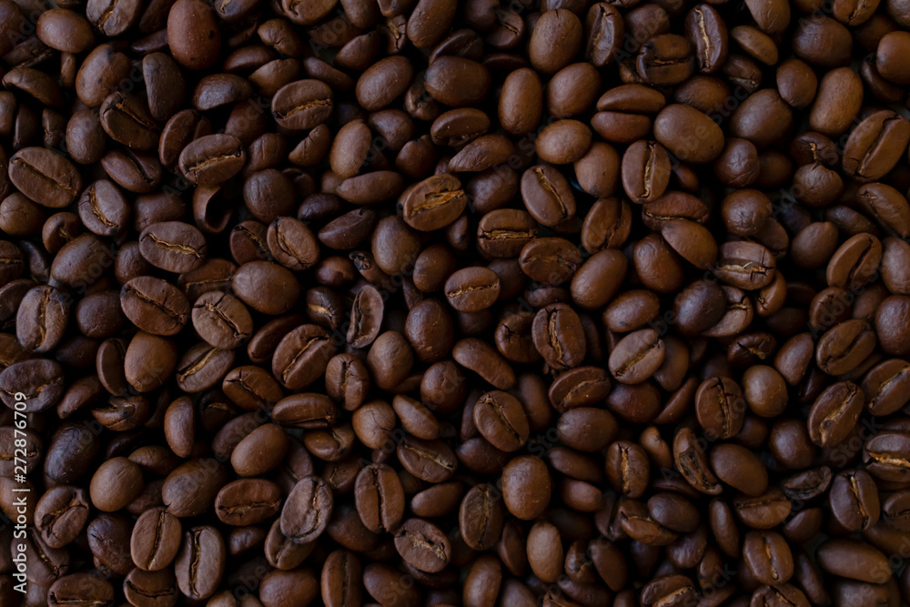Background made of coffee beans, top view for copy space Background made of coffee beans, top view for copy space