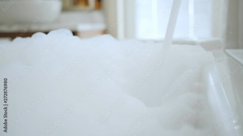 Abstract white foam bubbles structure pattern moving close-up detail. Abstract white foam bubbles structure pattern moving close-up detail.
