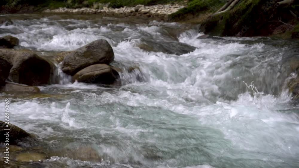 Close up of water stream with white and bubbles. Close up of water stream with white and bubbles.