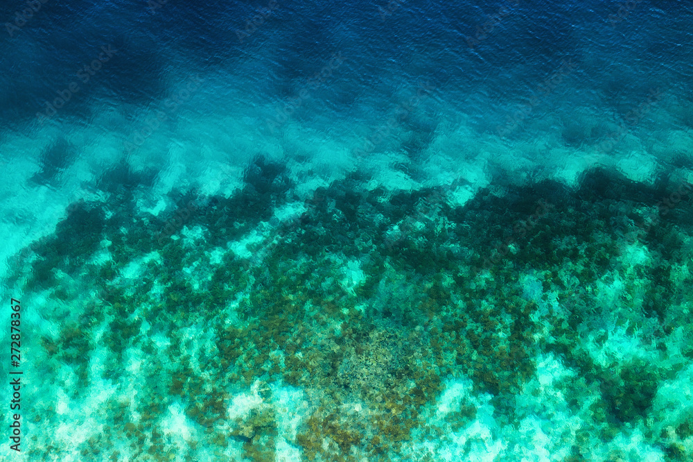 Ocean as a background from top view. Turquoise water background from top view. Summer seascape from air. Travel - image