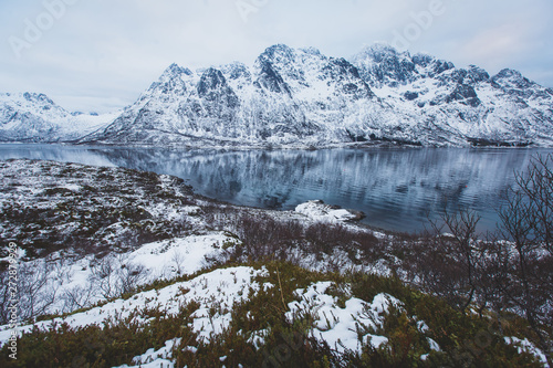 Beautiful panoramic winter view of Austnesfjorden, Sildpollen bay, Austvagoya island, Vagan Municipality, Nordland, Lofoten Islands, Norway, with fjord and mountains