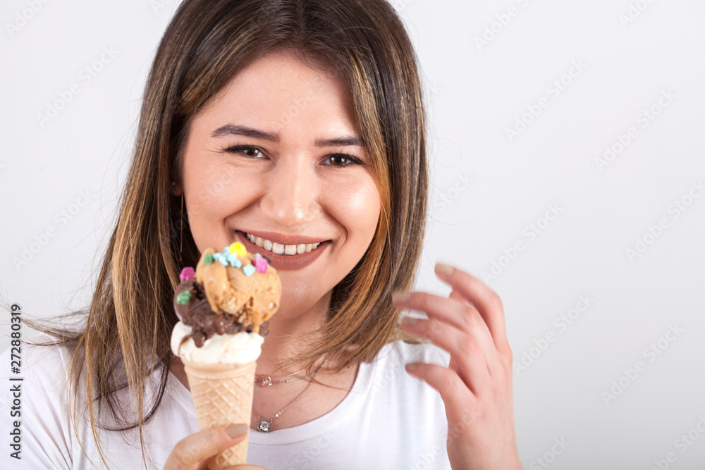 beautiful young woman eating ice cream