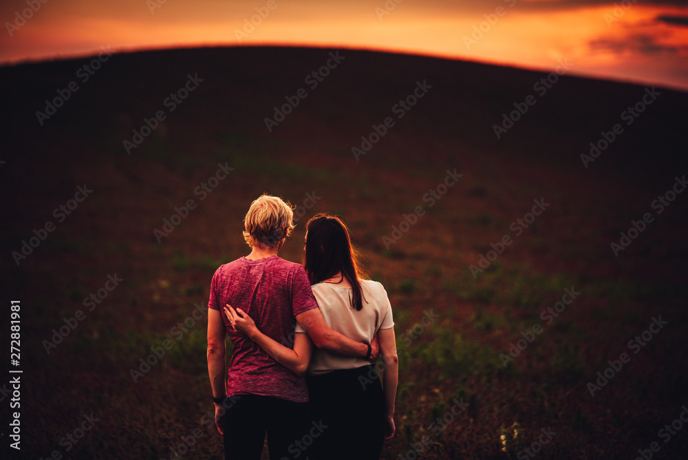 Dark sunset scenery and couple in love