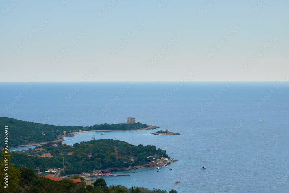 view of the Mamula Island-fortress on a sunny day near the ancient fortress Arza, a desert island in the Adriatic Sea, from a bird eye view.