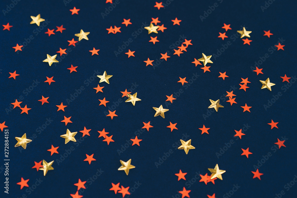 Dark blue background with yellow and red stars. Festive abstract concept. Background, great design for any purposes. Night party background Dark blue background with yellow and red stars. Festive abstract concept. Background, great design for any purposes. Night party background