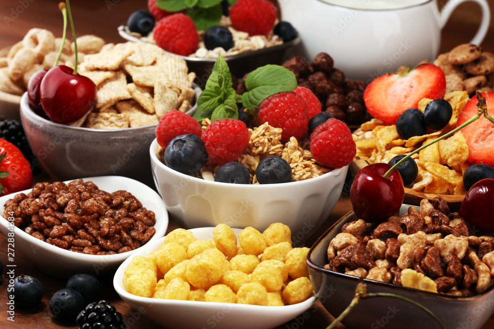 Cereal. Bowls of various cereals, berries and milk for breakfast. Muesli with kids cereals. Cereal. Bowls of various cereals, berries and milk for breakfast. Muesli with kids cereals.