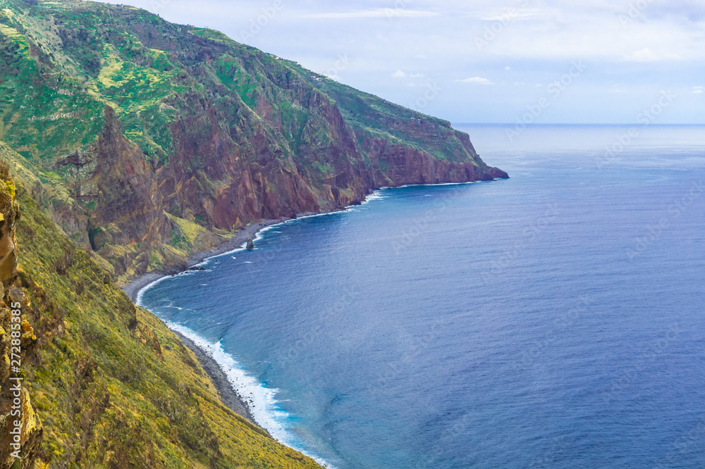 Aerial Madeira island view with Atlantic ocean, white waves, cliffs and nature