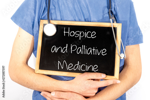 Doctor shows information on blackboard: hospice and palliative medicine.  Medical concept. photo