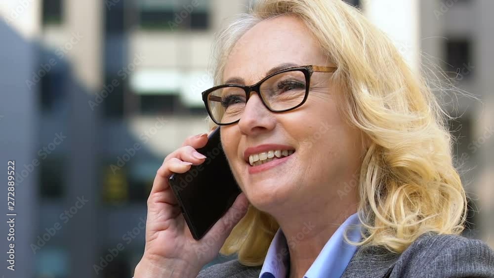Positive elderly politician discussing business over phone, mobile negotiations Positive elderly politician discussing business over phone, mobile negotiations