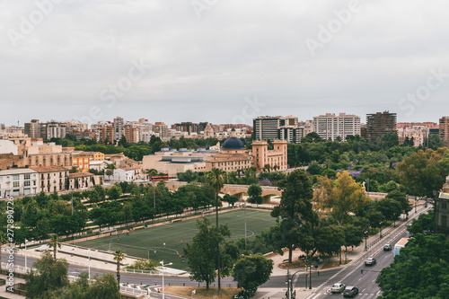 Valencia cityscape, bridge  across River Turia, currently a enormous park. Football field. Spain