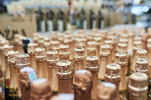 Sealed champagne bottles, background texture photo