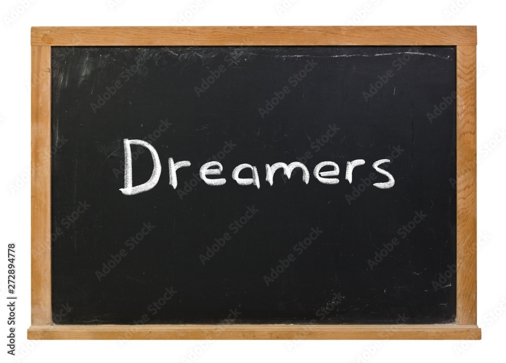 Dreamers written in white chalk on a black chalkboard isolated on white Dreamers written in white chalk on a black chalkboard isolated on white