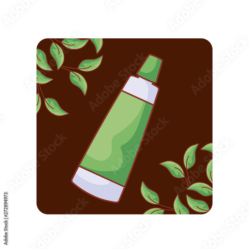 cream tube cosmetic in frame with natural leafs