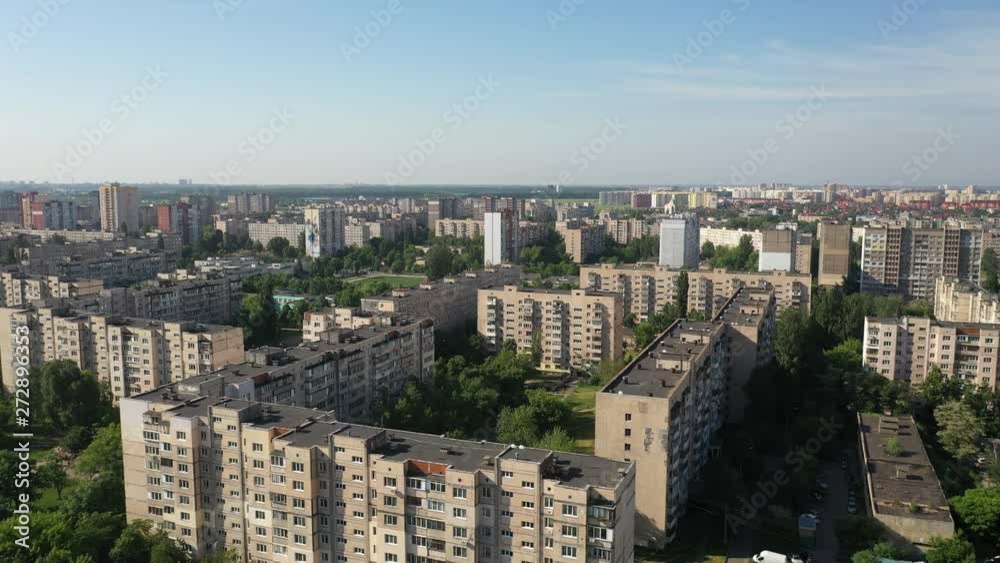 Aerial view of Housing Complex near an Electric Plant in Kyiv, Ukraine with a blue sky as background. Drone flying sideways Aerial view of Housing Complex near an Electric Plant in Kyiv, Ukraine with a blue sky as background. Drone flying sideways
