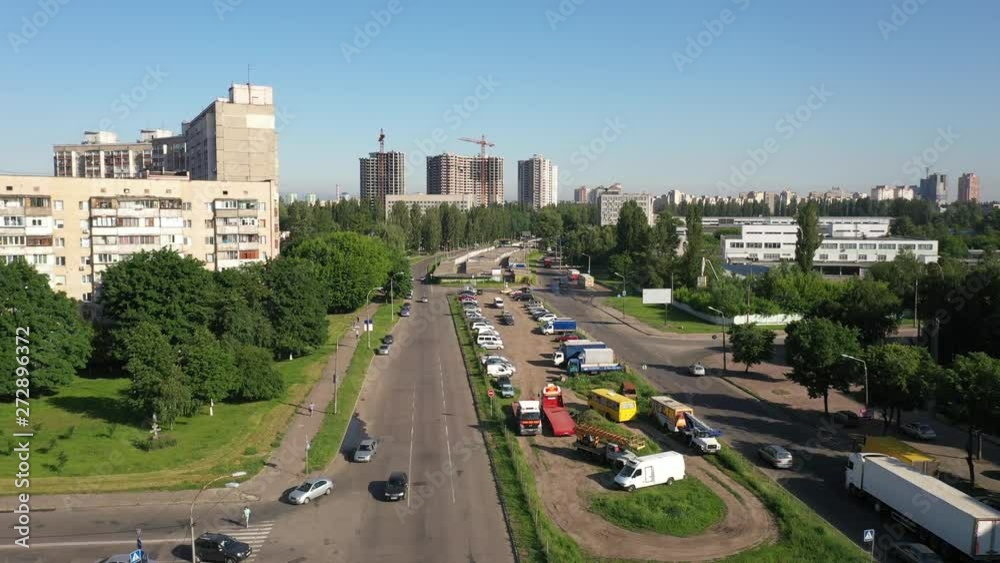 Aerial view of the traffic near an Electric Plant in Kyiv, Ukraine with a construction and cranes as background. Aerial view of the traffic near an Electric Plant in Kyiv, Ukraine with a construction and cranes as background.