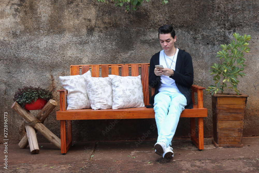 Fototapeta premium man sitting on a bench in the park