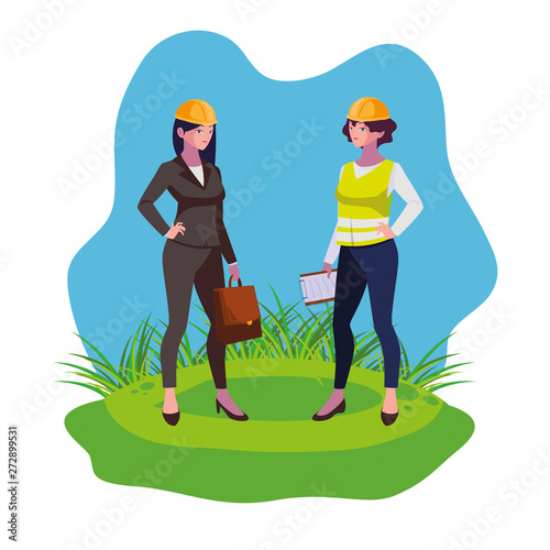 female builder and engineer woman on the lawn