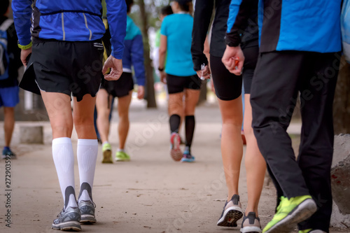 Group of people with sportswear walk doing exercise