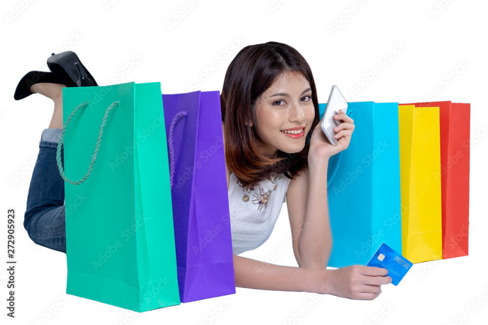 Happy woman in summer enjoying shopping with smartphone holding credit card and colorful shopping bag on white background, shopping concept, isolate concept. Happy woman in summer enjoying shopping with smartphone holding credit card and colorful shopping bag on white background, shopping concept, isolate concept.