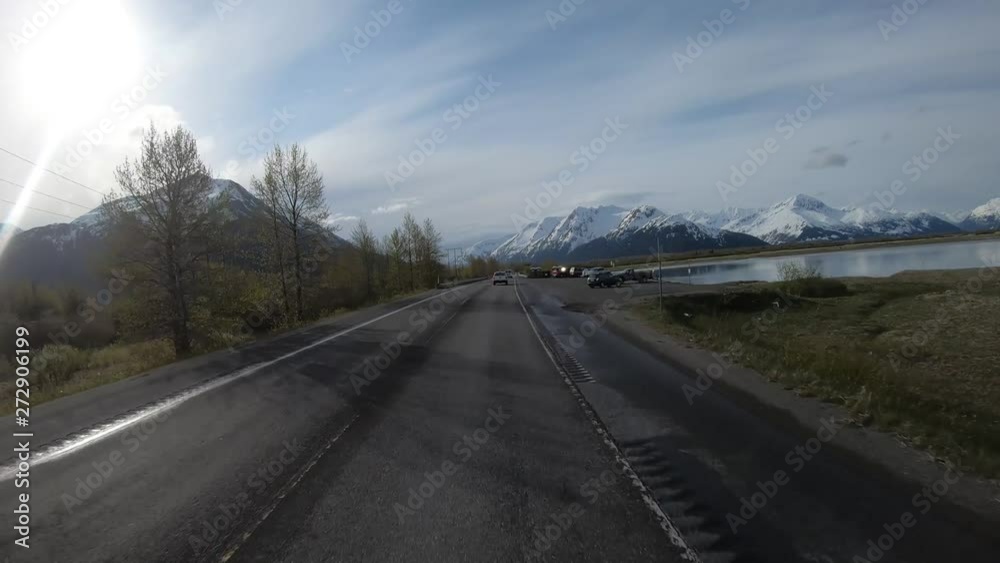 POV; Driving along Turnagain Arm on Seward Highway in Alaska, crossed Twentymile River with Chugach Mountains in Background POV; Driving along Turnagain Arm on Seward Highway in Alaska, crossed Twentymile River with Chugach Mountains in Background