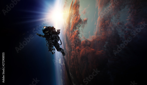 Astronaut in space on planet orbit.