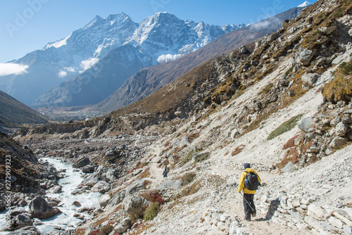 Back view of trekkers with beautiful landscape in Sagarmatha national park, Nepal. 
