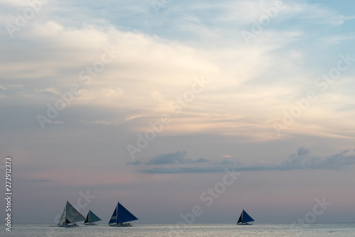 Yachts on the horizon in the dusk